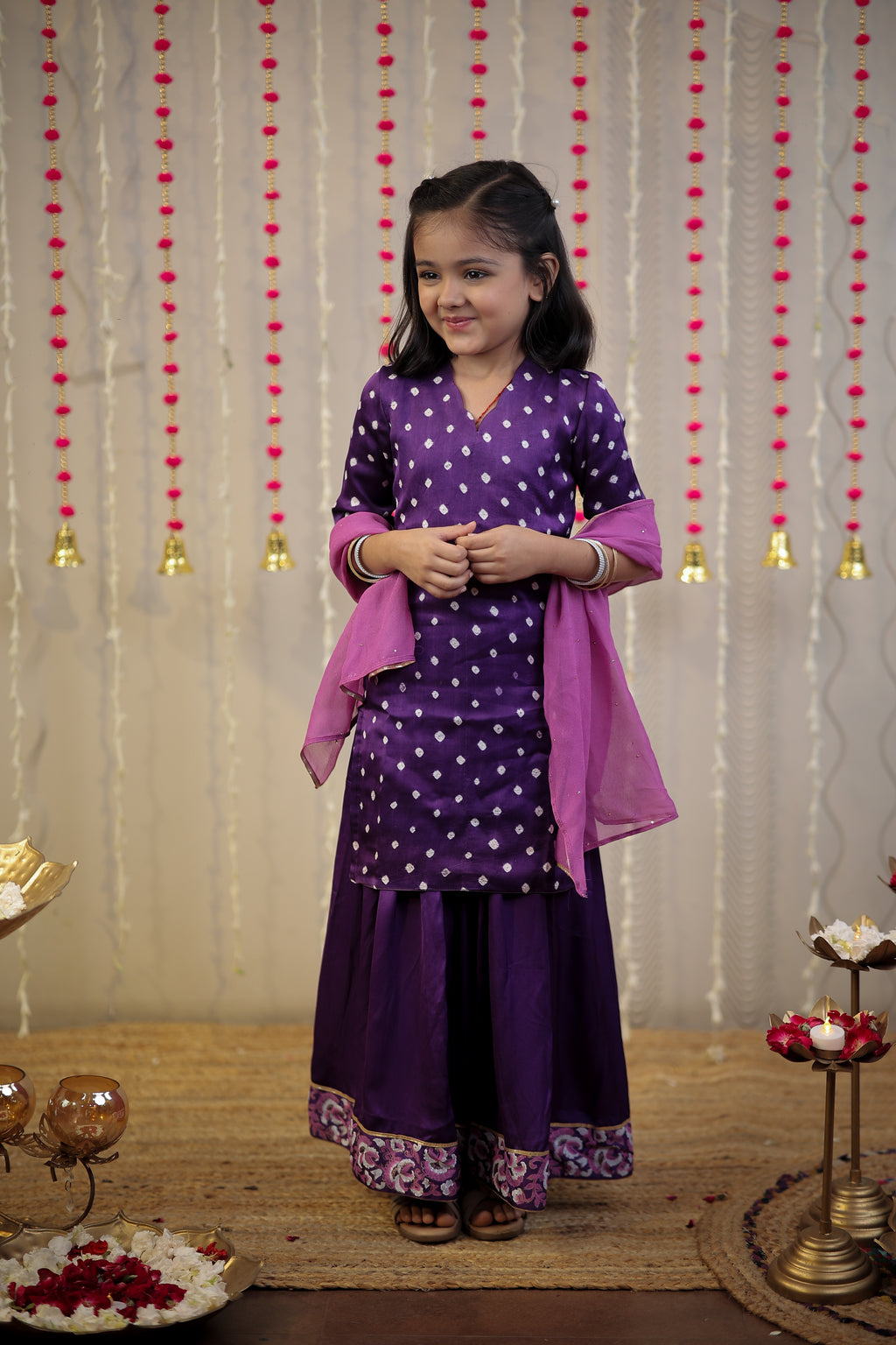 Purple Bandhej kurta with sharara set and dupatta.