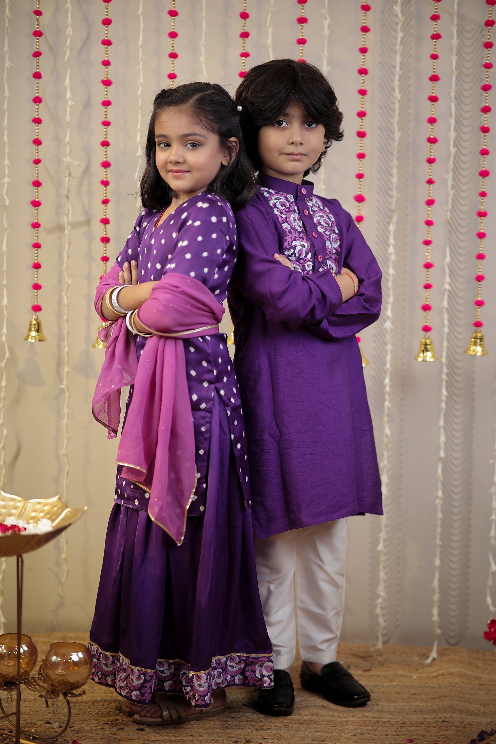 Purple Bandhej kurta with sharara set and dupatta.