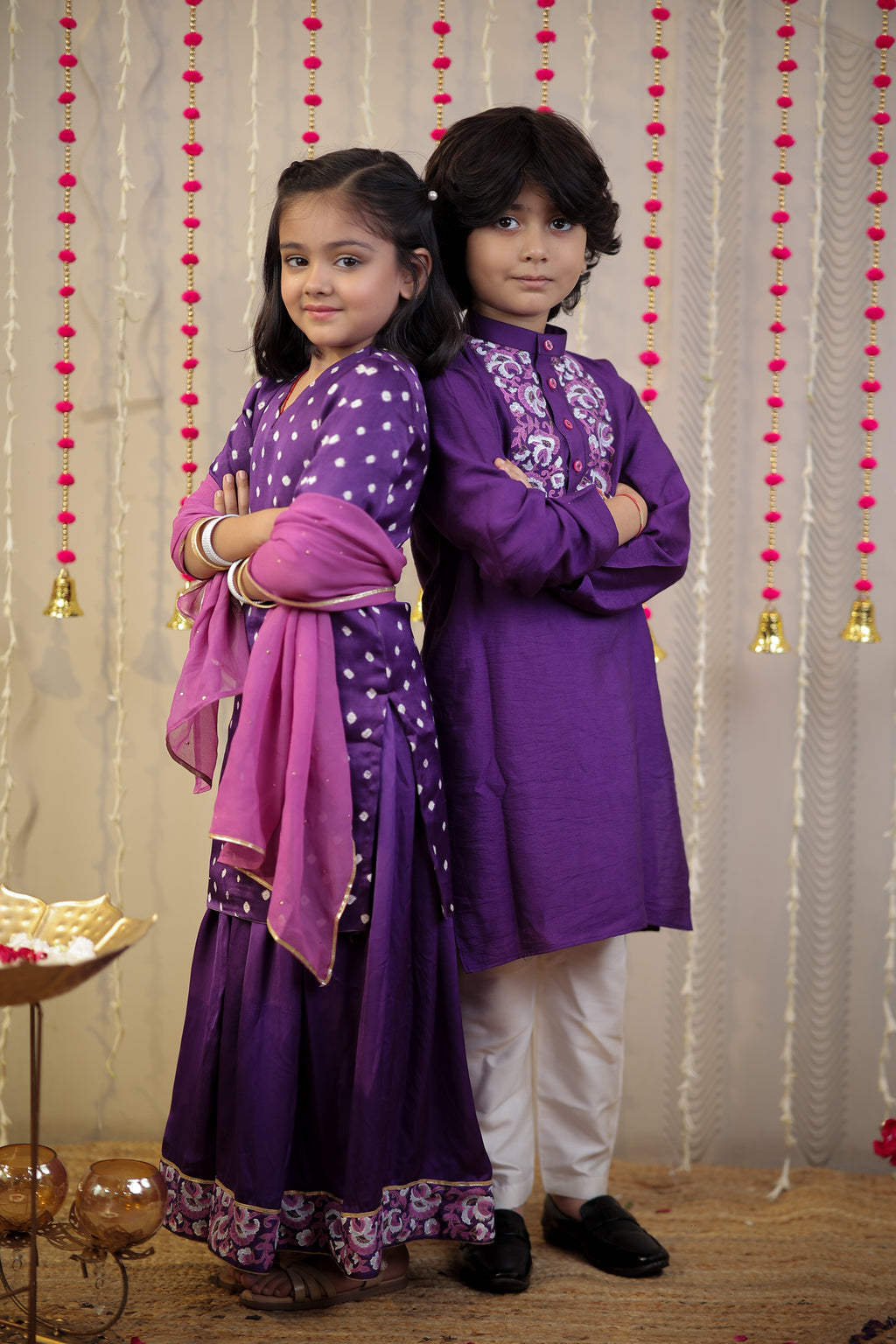 Purple Bandhej kurta with sharara set and dupatta.