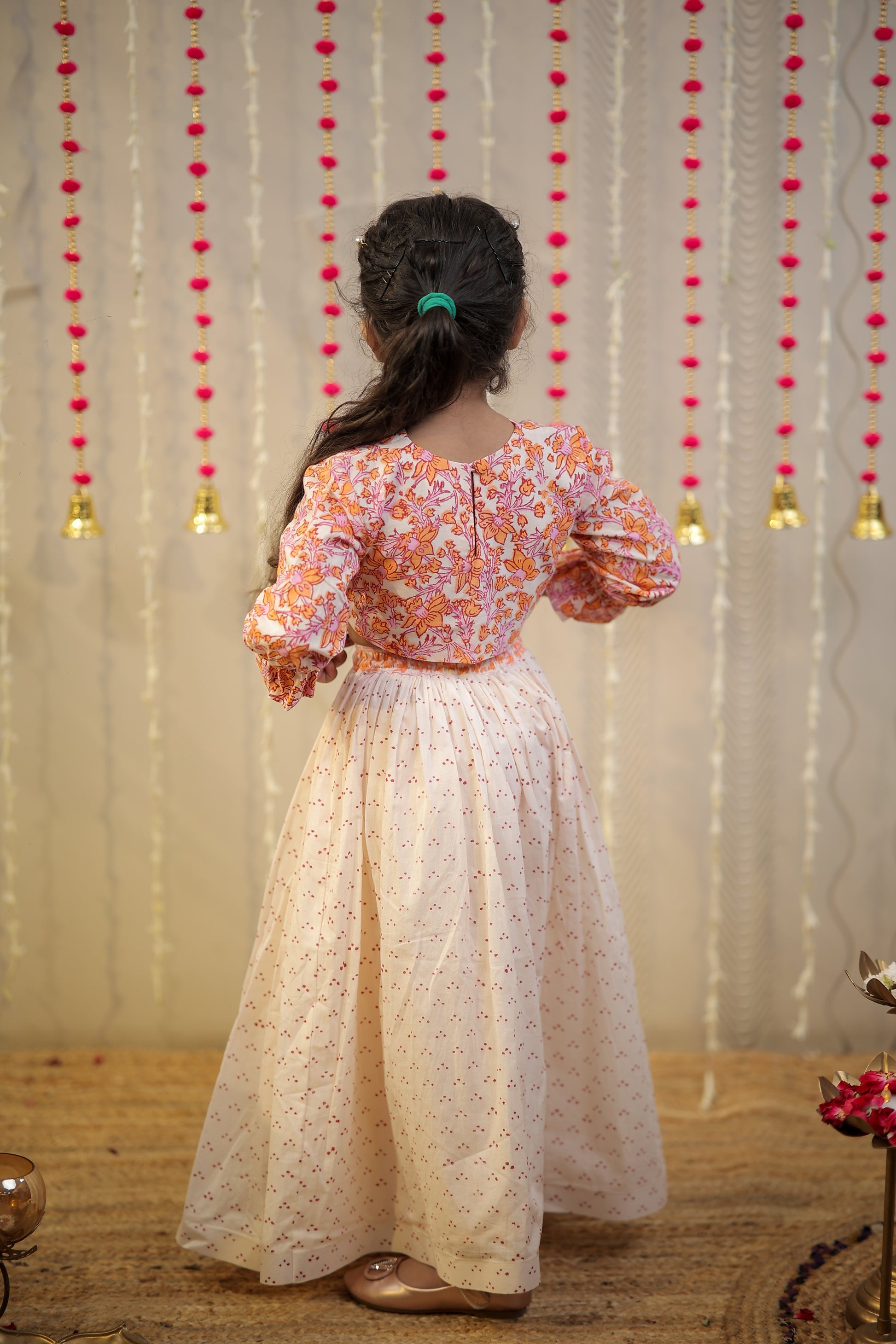 Peach orange block printed crop top with skirt.