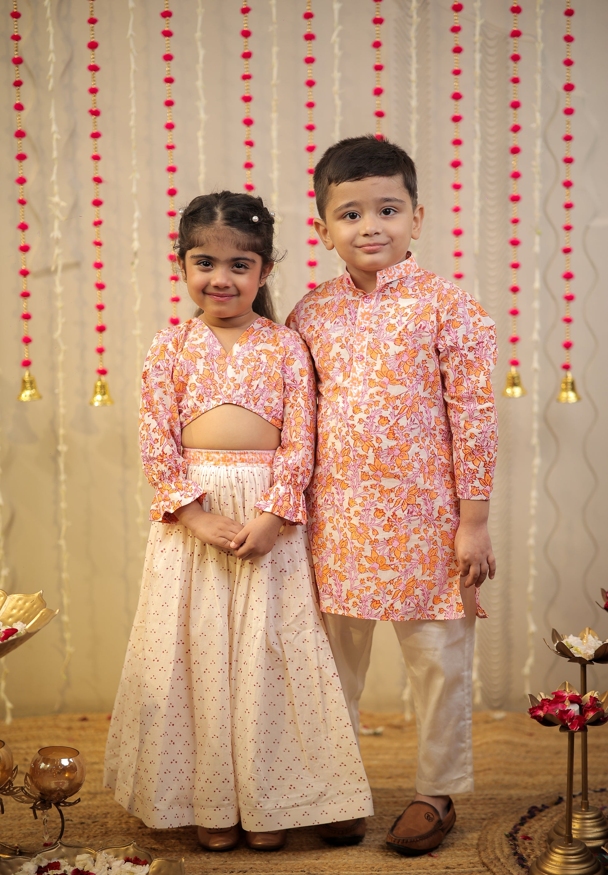 Peach orange block printed kurta set.