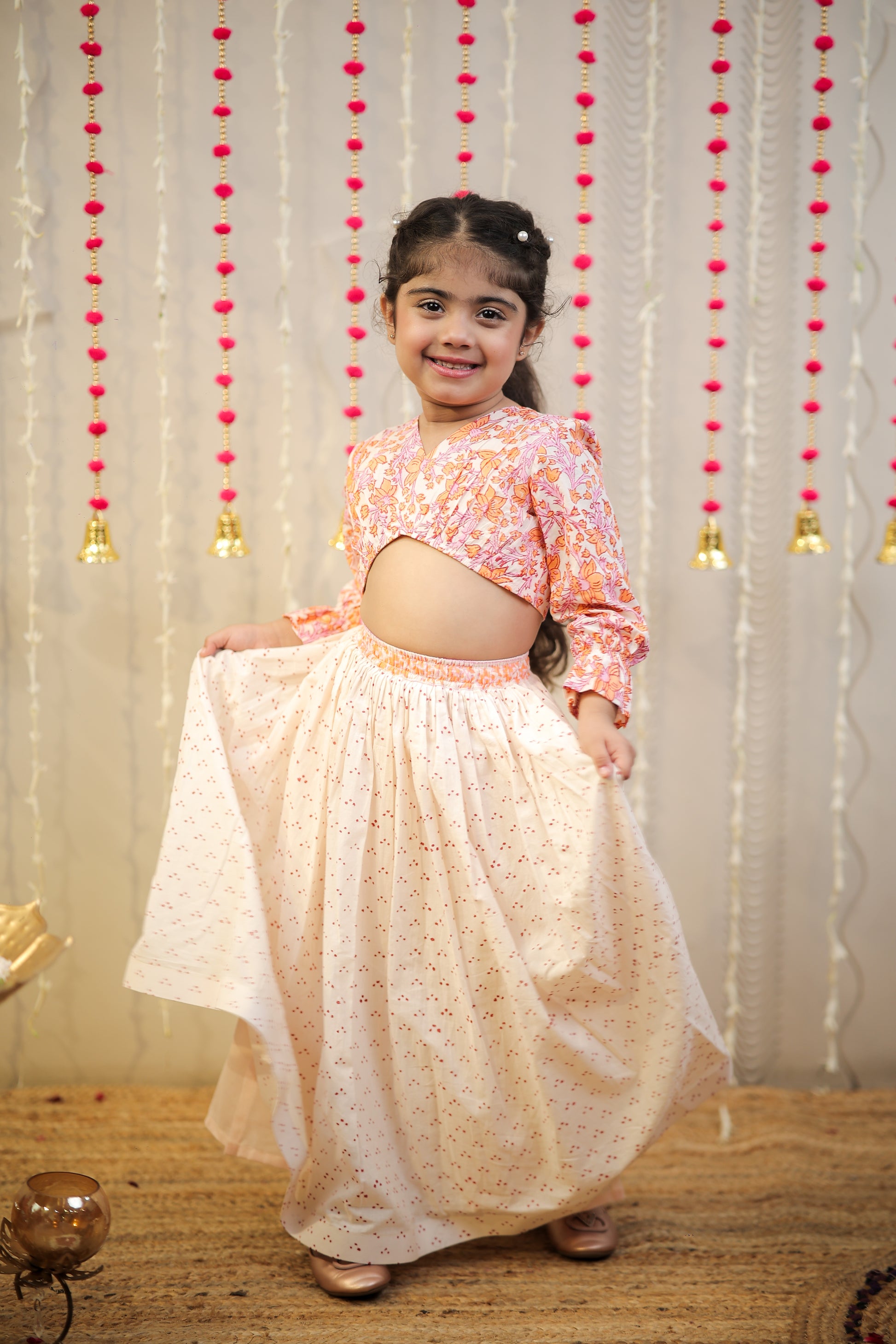 Peach orange block printed crop top with skirt.