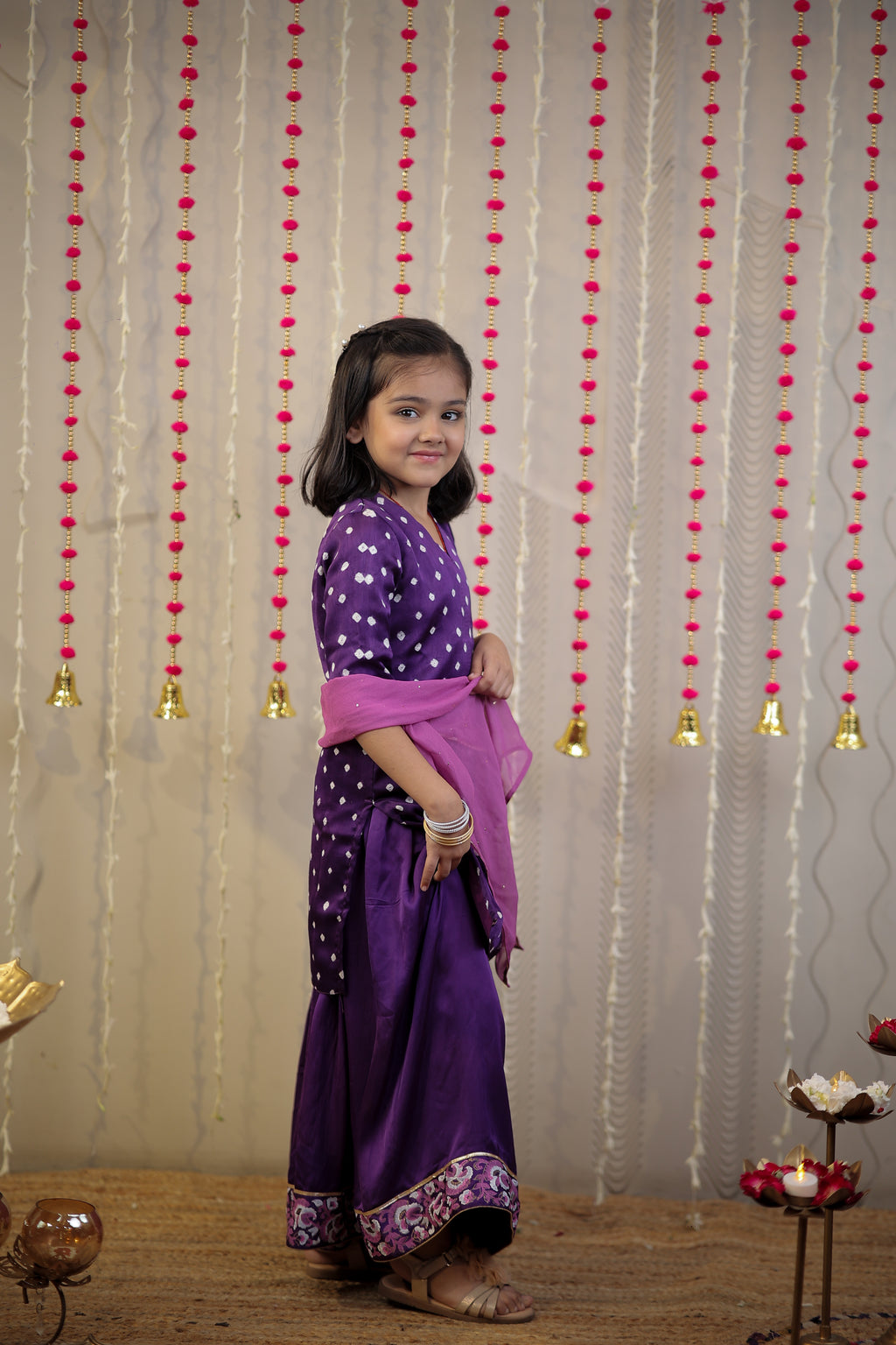 Purple Bandhej kurta with sharara set and dupatta.