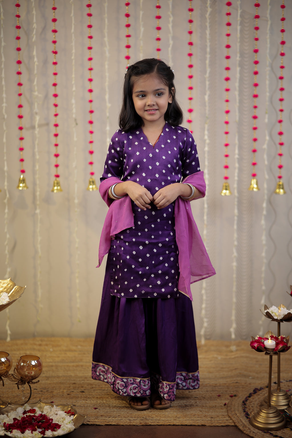 Purple Bandhej kurta with sharara set and dupatta.