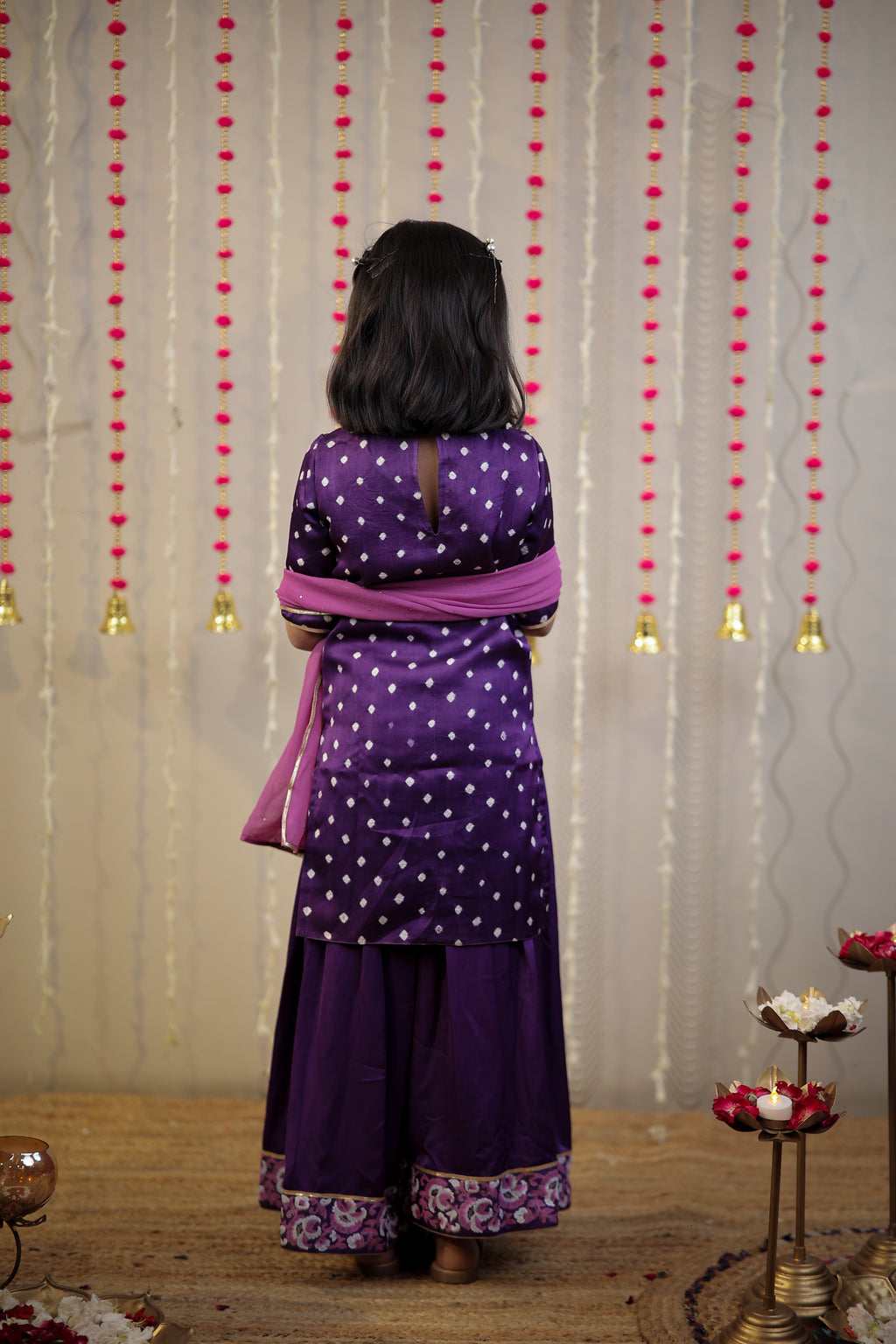 Purple Bandhej kurta with sharara set and dupatta.
